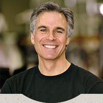 man with gray hair smiling