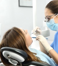 woman getting dental cleaning