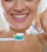 woman getting ready to brush teeth