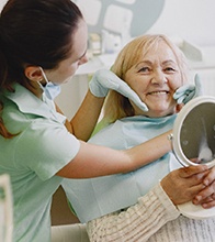Blaine dental patient discussing dentures with a friend 
