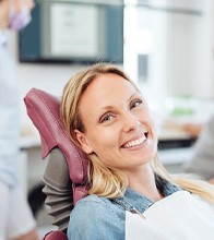 Woman smiling in the dental chair