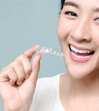 Happy young woman enjoying the benefits of Invisalign