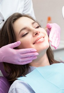 patient smiling in dental mirror