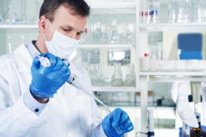 A scientist performing tests in a research lab.