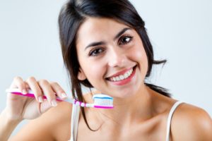 woman with toothbrush