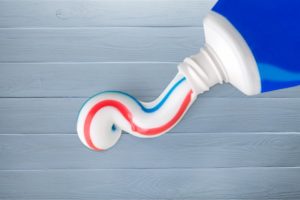 toothpaste container red blue white 