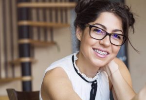 grinning woman with Six Month Smiles braces 