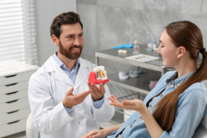 a patient attending their dental implant consultation